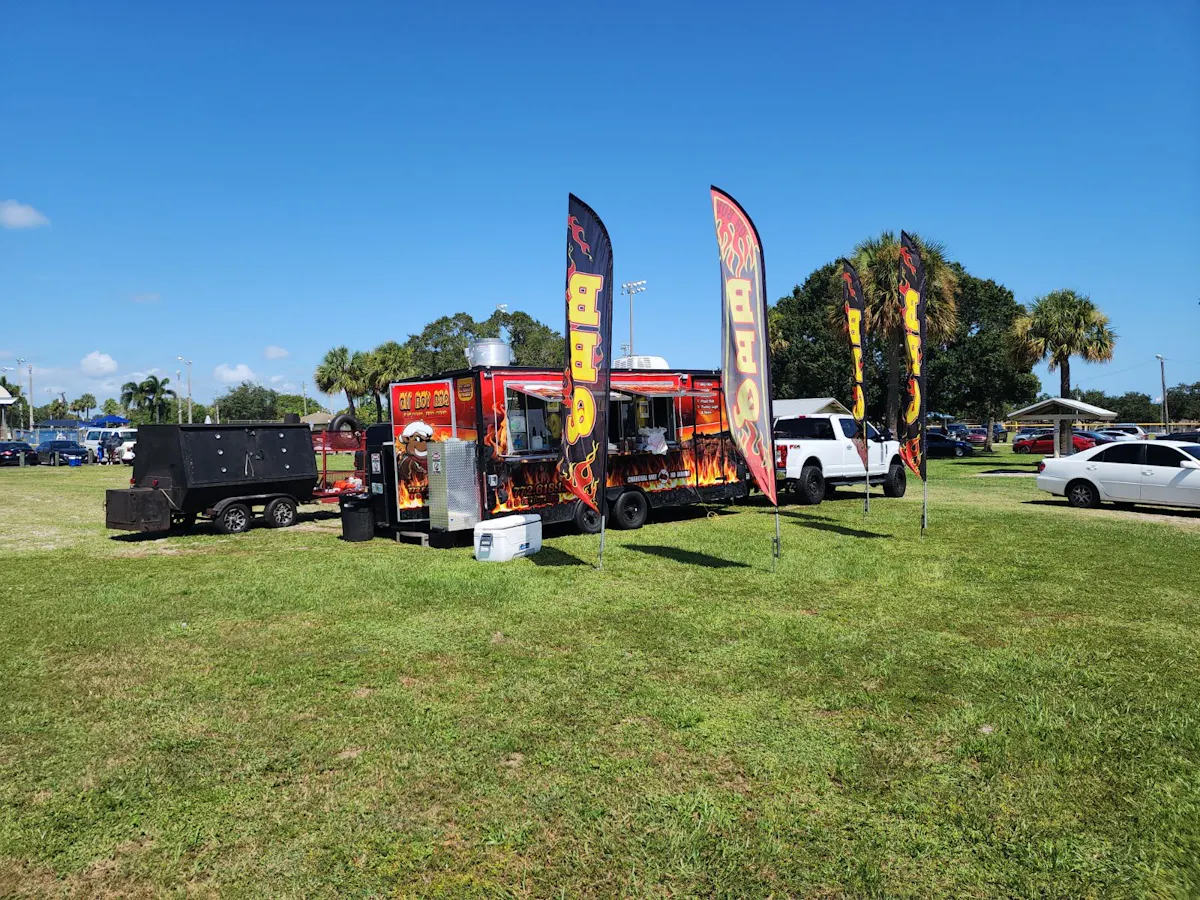 a truck is parked in a grassy field